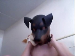 Kinky Girl gets off wearing a rubber dog mask